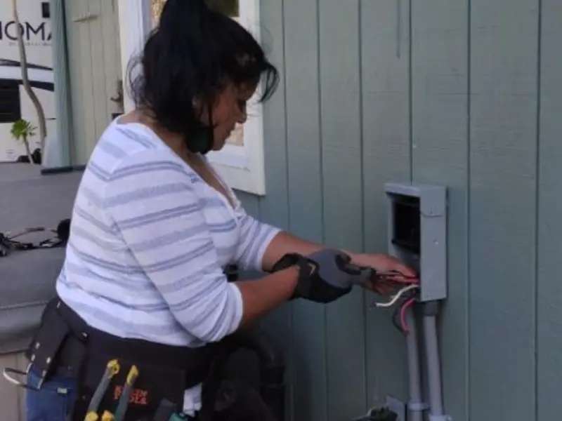 Licensed electrician wiring an exterior subpanel in Rural Hall