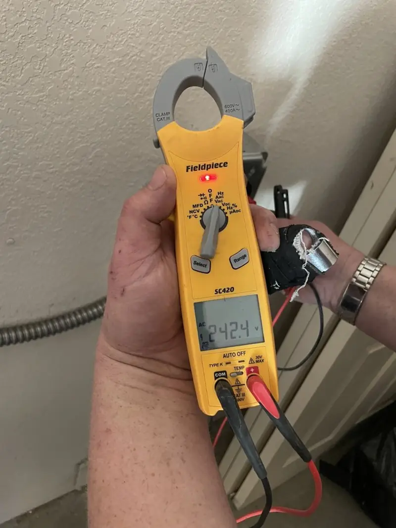 Voltage testing with clamp meter during Circuit Breaker Repair in Rural Hall